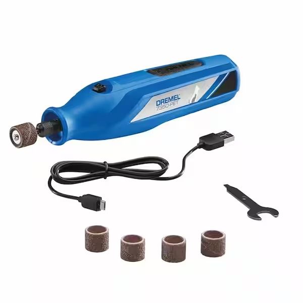 A professional dog nail grinder tool being prepared for home grooming